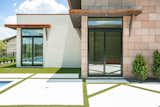 RAM sliding doors create a functional and welcoming entrance to this backyard pool area.