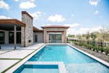 RAM sliding doors create a functional and welcoming entrance to this backyard pool area.
