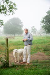 Christopher Garrett of Garrett Custom Homes stands on his property, home of his country farmhouse haven.