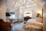 RAM white picture windows bring welcoming light into this country chic bedroom.