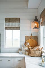 This cozy farmhouse style kitchen corner is made complete by RAM white aluminum picture windows.