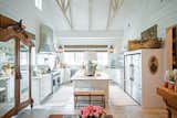 This bright farmhouse kitchen with high ceilings and shiplap is made complete by the aluminum white RAM windows with classic grids. 