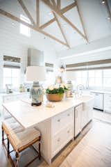 This bright farmhouse kitchen with high ceilings and shiplap is made complete by the aluminum white RAM windows with classic grids. 