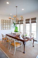 RAM white picture windows bring welcoming light into this dining area.