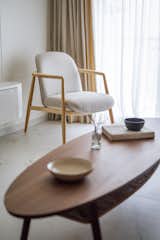 The material palette for the living is grounded in simplicity and  suggests a connection to nature, features clean lines, a neutral palette, and minimal styling.
