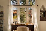 Original windows and restored built ins featured in the living room.