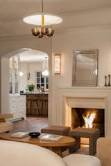 Living room fireplace in the main house with a view of the kitchen.