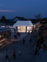 Overall view of White Is Good Shop in the village at night
