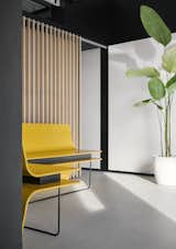 Reception and waiting :

As the reception area serves as the initial point of contact. What makes this sight intriguing is the fact that the yellow metal benches, weighing approximately 600 kg, are beautifully balanced by sleek, delicate metal rods on the other end. This intentional paradox is designed to entice curious observers. In addition, a louvred partition is positioned behind these metal benches to serve as a sliding screen, discreetly shielding the discussion zone from guests waiting outside.