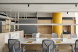 Workstations :

As for the unexpected pops of yellow,  it wasn't initially on the moodboard.However, during the iterative design process, the idea to paint a circular column yellow emerged and quickly gained momentum. Before long, the vibrant hue began to sneak its way into other areas of the space, adding playful accents throughout.