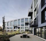 The sculptural roofline creates apartments with high, sloped ceilings.