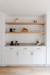 Oak is featured throughout the home to add warmth including these display shelves that feature concealed lighting