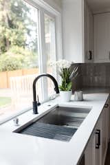 The project features matte black hardware and fixtures 