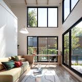 By stacking the modules, the structure can reach new heights and series of large window panes can be placed. This allows ample natural light to enter the space.