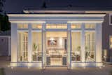 An evening photo with exterior lighting accents.