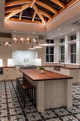 The Orangery kitchen addition in the evening with the accent lighting on the timber framed sky lantern.