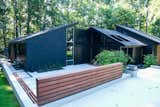The jatoba wood screen and benches add a natural texture within the concrete and brick.
