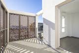 The balcony restores privacy and extends the interior space.