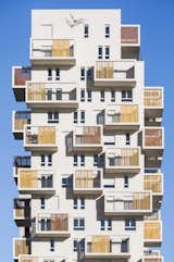 Marseille-inspired cabanons dress the facade of the tower. 