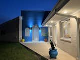 Porch at nighttime with energy-efficient light fixtures.