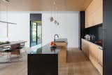 Kitchen with Blackened stainless steel countertop