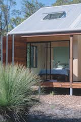 Main Bedroom, no internal connection to the rest of the house. You need to walk outside, onto the deck (and feel the elements) to walk between the two spaces.