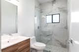 Modern bathroom with natural materials at L2 House