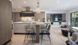 Open concept kitchen by Scavolini with adjacent family room