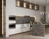 The kitchen seamlessly blends the timeless sophistication of white and fluted glass fronts with the advanced functionality of Sub-Zero integrated appliances. The sleek, glossy surfaces and clean lines highlight the minimalist design while complementing the bright, polished ambiance.