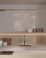 The open shelf, a central feature of this Japandi kitchen, includes built-in LED lighting that casts a warm glow, enhancing both the ambiance and the overall sense of calm and simplicity.