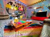 Living room/Home studio/HomeBar/Nightclub: TV testcard mural wall is actually wallpaper in 3 massive sections. Was impossible to put up. Mario wall was painted blue then stickers applied