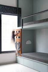 Playfulness in the Kid's Bedroom
 The kid's bedroom is designed with ample space for play, featuring a sturdy yet 
child-friendly bunk bed. It's a space where imagination can run wild and where 
the child can grow and explore safely