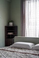 Serenity in the Master Bedroom
 The master bedroom, painted in a soothing green lime color, offers a calming and 
relaxed atmosphere, perfect for unwinding after a long day. This cozy and 
comfortable bedroom is a personal retreat for our clients, reflecting their serene 
and peaceful nature.