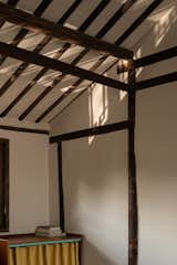 The light is reflected on the ceiling by the river through the windows.