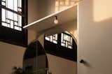 The light shining into the room through the old window at dusk.