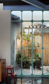 View of the courtyard through the custom-made metal windows.
