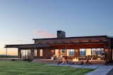 A cozy fire pit completes this backyard oasis. 