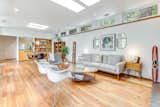 The home's interior is a study in contrasts, featuring exposed block walls that exude raw elegance.
