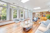Living room lined with windows let in the coastal ambiance