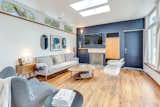 The Rumford fireplace offers both form and function, serving as a cozy focal point