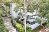 The home's low profile and use of earth-toned materials allow it to blend seamlessly with the environment, making it a sanctuary that feels at one with the coastal ecosystem.