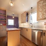 Butcher block island, display shelving, and sink wall