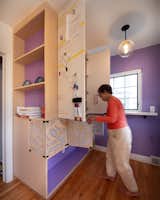 Foldown work counter and storage cabinets with magnetic white board