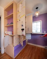 Foldown work counter and storage cabinets with magnetic white board