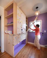 Foldown work counter and storage cabinets with magnetic white board