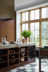 The kitchen is made according to an individual project of “Art bureau 1/1 | Oneoverone” from maple veneer with the effect of patinated copper. Manufactured by the ABC factory. Kitchen accessories, all Crate and Barrel.