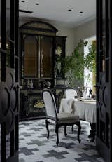Dining room. The Flemish cabinet is the main character of the interior, brought from the previous object by the client. The marble “Byzantine crosses” on the floor according to the sketches of “Art bureau 1/1 | Oneoverone” were made in Italy. Table textiles, linen, Marki Home.