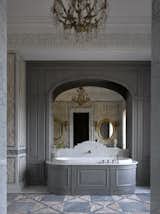 Master bedroom bathroom. Rosa Norvegia pink marble. Plaster details and furniture designed by "Art Bureau 1/1| Oneoverone". 19th century French chandelier.