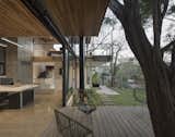The deck serves as an extension of the space, creating a seamless transition between the interior and the exterior