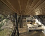 Organic texture of the wooden ceiling, adding warmth and a connection to nature within the space